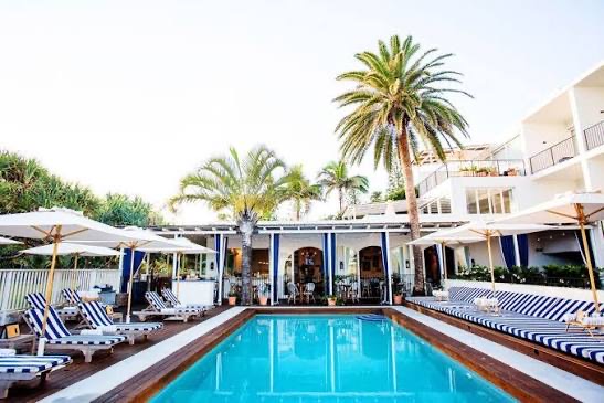 Coastal boutique hotel above turquoise water